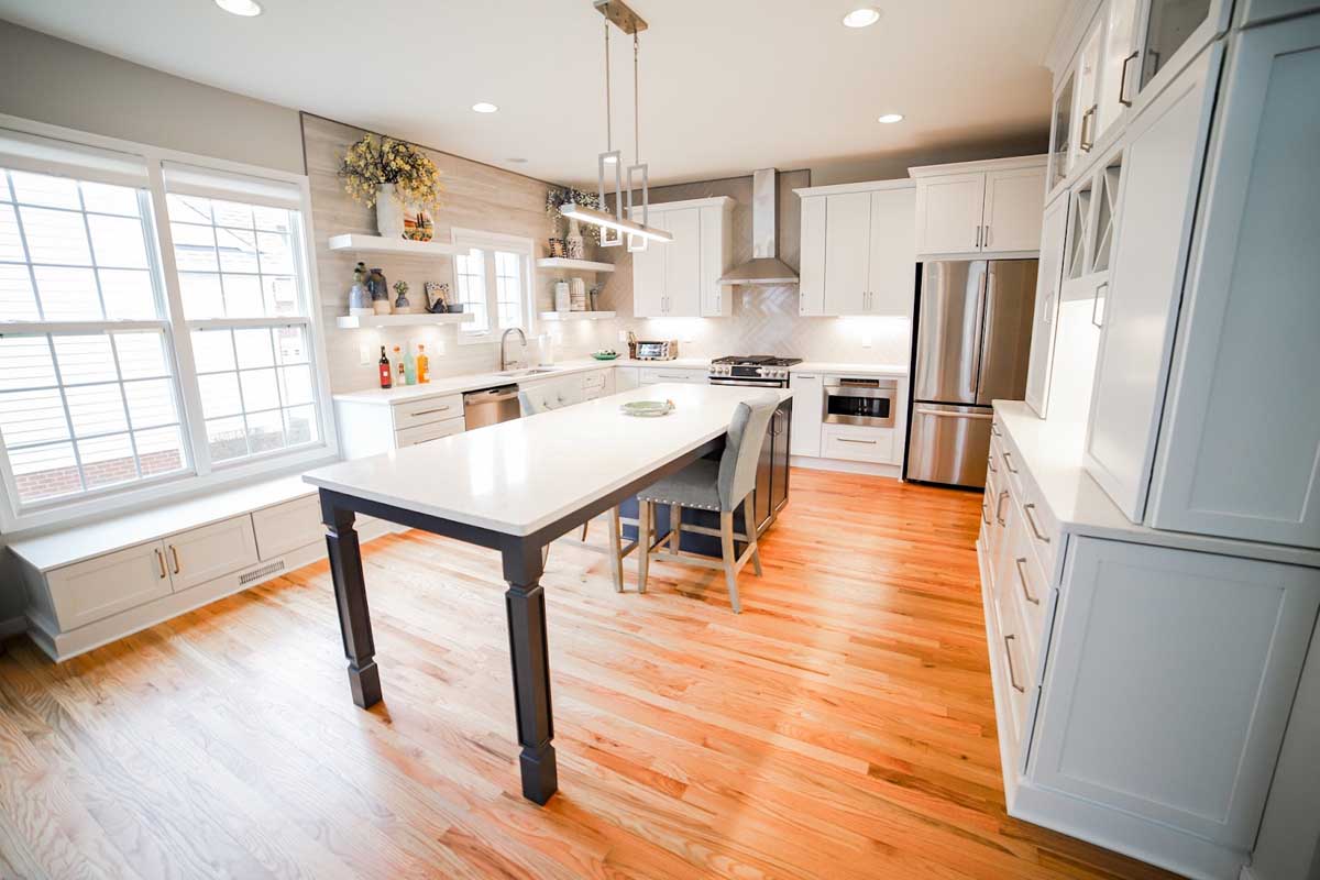 Kitchen remodel / renovation in Manakin-Sabot, Virginia by BK Martin showing a long island centered on the kitchen illuminated with lots of bright natural light. 
