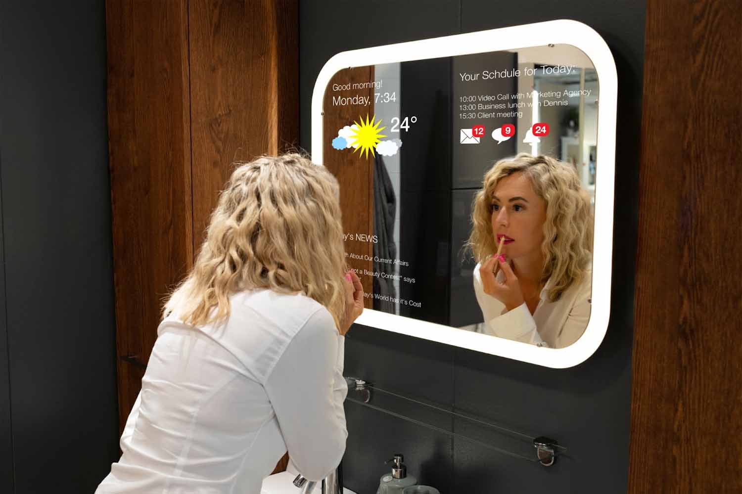 Woman in bathroom using smart mirror to put on lipstick